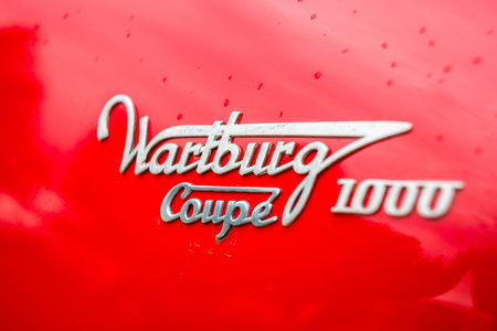 PAAREN IM GLIEN, GERMANY - JUNE 03, 2017: Emblem of the Wartburg 311 Coupe 1000, closeup. Focus on the center. Exhibition "Die Oldtimer Show".のeditorial素材