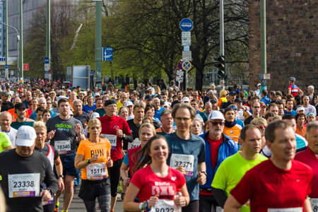 BERLIN - APRIL 02, 2017: The annual 37th Berlin Half Marathon. Athletes run on Karl-Liebknecht-Strasse (Karl Liebknecht Street).のeditorial素材