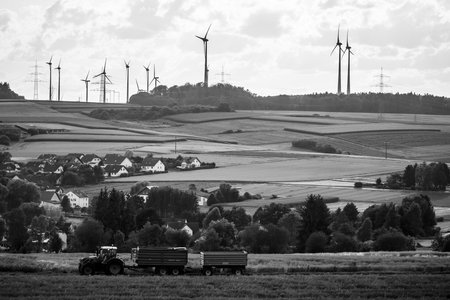 NEUSTADT, GERMANY - JULY 30, 2017: View of the small town of Neustadt, a suburb and surrounding agricultural land and agricultural machinery. Black and white.のeditorial素材