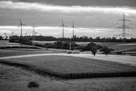 Agricultural machinery on the fields in the suburbs of the small town of Neustadt (Marburg-Biedenkopf district in Hessen). Black and white.の写真素材