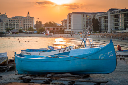 POMORIE, BULGARIA - AUGUST 18, 2017: Boats on the beach. Beautiful sunset.のeditorial素材