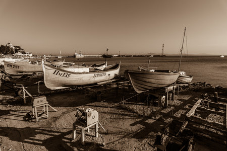 POMORIE, BULGARIA - AUGUST 17, 2017: Fishing boats on the shore. Seaport of the seaside town of Pomorie. Stzliyation. Sepia.のeditorial素材