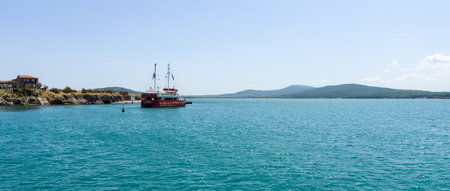 BURGAS, BULGARIA - AUGUST 20, 2017: Pleasure boats with tourists in the Burgas Bay. Burgas, is the second largest city on the Bulgarian Black Sea Coast.のeditorial素材