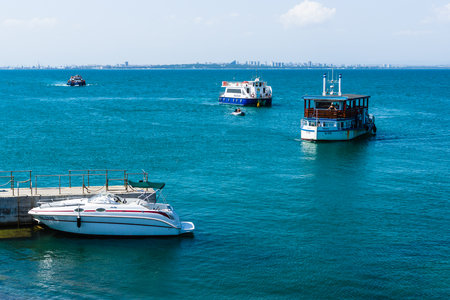 BURGAS, BULGARIA - AUGUST 20, 2017: Pleasure boats with tourists in the Burgas Bay. Burgas, is the second largest city on the Bulgarian Black Sea Coast.のeditorial素材