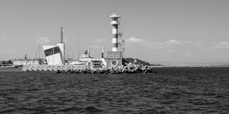 BURGAS, BULGARIA - AUGUST 20, 2017: Lighthouse, control tower of the seaport of Burgas. Black and white. Burgas, is the second largest city on the Bulgarian Black Sea Coast.のeditorial素材