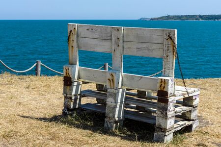 Wooden benches on the high seashore. Seascape.の写真素材