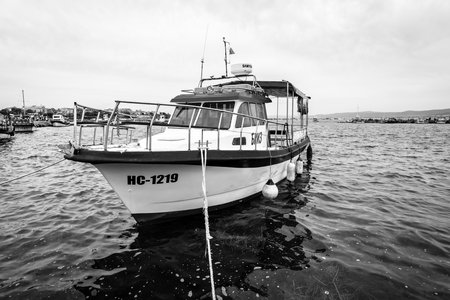 NESEBAR, BULGARIA - AUGUST 21, 2017: Pleasure boats on the pier of the old town of Nesebar. Nesebar is an ancient city and one of the major seaside resorts on the Bulgarian Black Sea Coast. Black and white.のeditorial素材