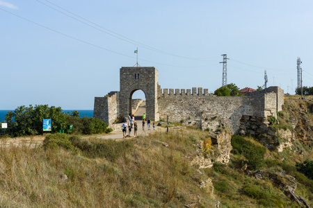 CAPE KALIAKRA, BULGARIA - AUGUST 23, 2017: The medieval fortress of Kaliakra. The preserved part of the fortress wall and the watchtower.のeditorial素材