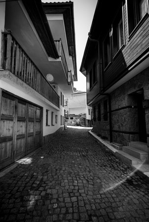 SOZOPOL, BULGARIA - AUGUST 24, 2017: Narrow streets of an ancient seaside town on the southern Bulgarian Black Sea Coast. Black and white.のeditorial素材