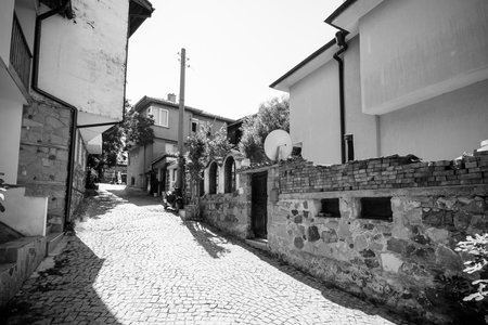 SOZOPOL, BULGARIA - AUGUST 24, 2017: Narrow streets of an ancient seaside town on the southern Bulgarian Black Sea Coast. Black and white.のeditorial素材