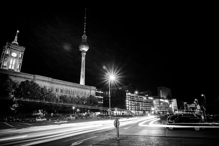 BERLIN - OCTOBER 08, 2017: Downtown in the night lights. In the background, the Berlin TV Tower (Fernsehturm) and the Red Town Hall (Rotes Rathaus). Black and white.のeditorial素材