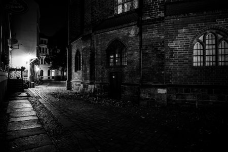 BERLIN - OCTOBER 08, 2017: An ancient street in the historical quarter of Nikolaiviertel (Nicholas' Quarter). Black and white.のeditorial素材