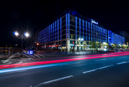 BERLIN - OCTOBER 08, 2017: The popular five-star Radisson Blu hotel in the original evening illumination.のeditorial素材