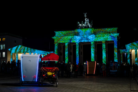 BERLIN - OCTOBER 08, 2017: The famous Brandenburg Gate in the festival illumination. Festival of lights 2017.のeditorial素材