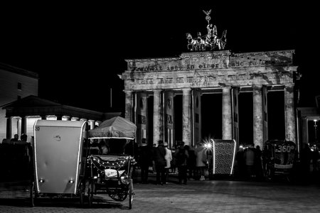 BERLIN - OCTOBER 08, 2017: The famous Brandenburg Gate in the festival illumination. Festival of lights 2017. Black and white.のeditorial素材