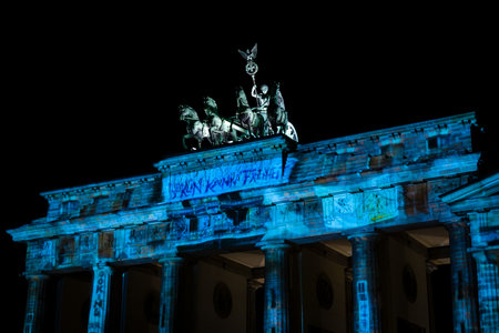 BERLIN - OCTOBER 08, 2017: Fragment of the Brandenburg Gate in the festival illumination. Festival of lights 2017.のeditorial素材