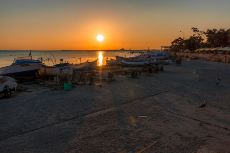 POMORIE, BULGARIA - AUGUST 26, 2017: View of the water area and the fishing boats of the seaport of the seaside resort town of Pomorie.のeditorial素材