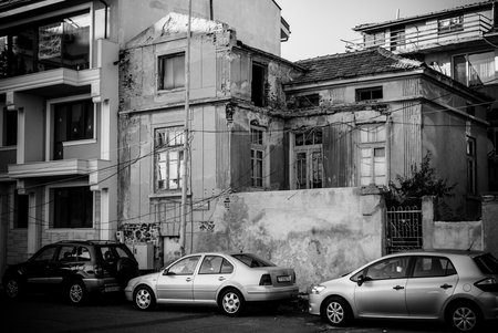 POMORIE, BULGARIA - AUGUST 26, 2017: Old and dilapidated house in the center of the seaside resort town of Pomorie. Black and white.のeditorial素材
