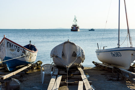 POMORIE, BULGARIA - AUGUST 26, 2017: Fishermen's boats stand on the shore of the seaport of the seaside resort town of Pomorie.のeditorial素材