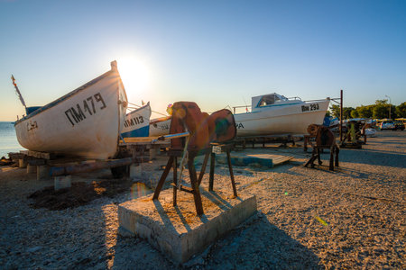 POMORIE, BULGARIA - AUGUST 26, 2017: Fishermen's boats stand on the shore of the seaport of the seaside resort town of Pomorie.のeditorial素材