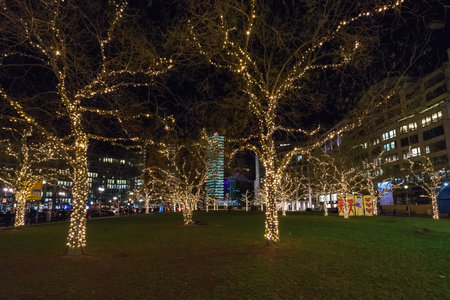 BERLIN - DECEMBER 18, 2017: Decorated for Christmas with brightly colored garlands of trees at Leipziger Platz.のeditorial素材
