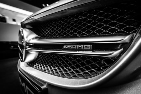 BERLIN - DECEMBER 21, 2017: Showroom. Detail of the mid-size car Mercedes-Benz C-Class AMG C63 (W205). Black and white. Since 2015.のeditorial素材
