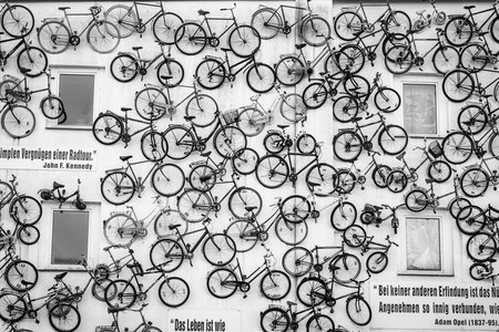 ALTLANDSBERG, GERMANY - FEBRUARY 21, 2018: The unusual design of the bike store "Fahrradhof Altlandsberg". The facade of the building is decorated with old bicycles. Black and white.のeditorial素材