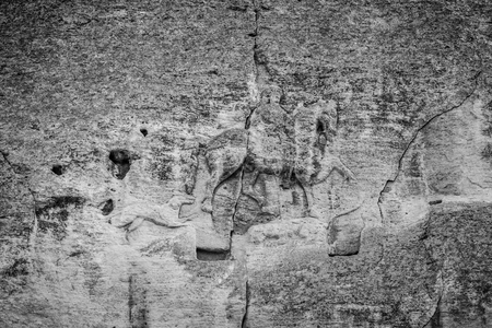 Madara Rider - an archaeological monument of the early Middle Ages (the end of the 7th century), a relief image of a rider carved on a steep rock. Bulgaria. Black and white.の写真素材