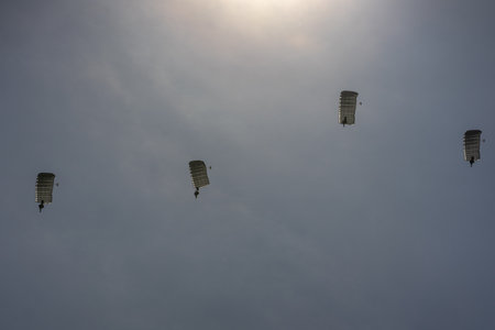 BERLIN, GERMANY - APRIL 27, 2018: Parachutists in the sky. Exhibition ILA Berlin Air Show 2018.のeditorial素材