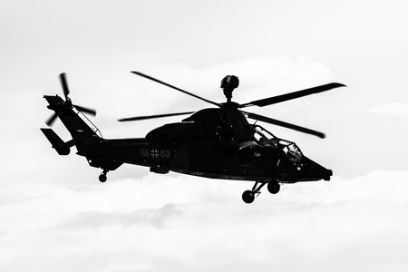 BERLIN, GERMANY - APRIL 26, 2018: Demonstration flight of attack helicopter Eurocopter Tiger UHT. German Air Force. Black and white. Exhibition ILA Berlin Air Show 2018のeditorial素材