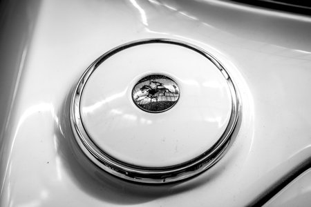 BERLIN - MAY 06, 2018: Fuel tank cap of a sports car Ferrari 330 GT 2+2 Series II, 1967. Black and white. Exhibition 31. Oldtimertage Berlin-Brandenburg (31th Berlin-Brandenburg Oldtimer Day).のeditorial素材