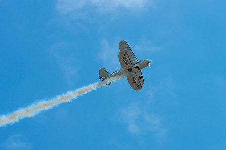 BERLIN - APRIL 26, 2018: Demonstration flight sport biplane Stolp Starduster Too SA300. Exhibition ILA Berlin Air Show 2018.のeditorial素材