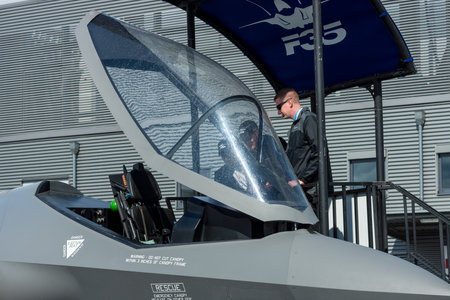 BERLIN, GERMANY - APRIL 26, 2018: Visitors look at the cockpit of the stealth multirole fighter Lockheed Martin F-35 Lightning II. US Air Force. Exhibition ILA Berlin Air Show 2018のeditorial素材