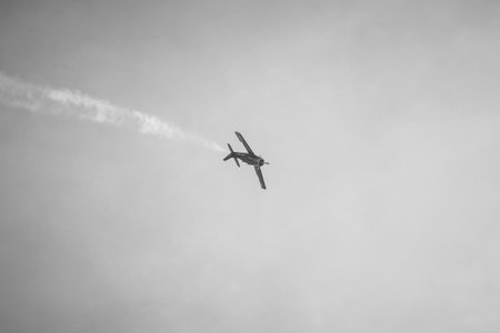 BERLIN - APRIL 27, 2018: Demonstration flight of light attack/trainer aircraft North American T-28B Trojan. Black and white. Exhibition ILA Berlin Air Show 2018.のeditorial素材