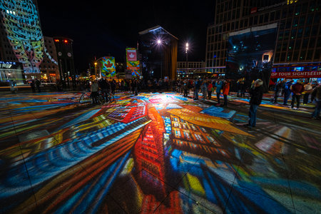 BERLIN - OCTOBER 07, 2018: Potsdamer Platz in brightly colored illuminations. Festival of lights 2018.のeditorial素材