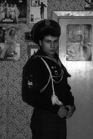 MOSCOW REGION, RUSSIA - CIRCA 1992: Portrait of a russian sailor in an apartment. Film scan. Large grain, circa 1992のeditorial素材