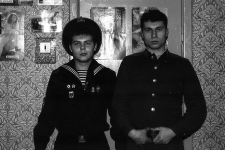 MOSCOW REGION, RUSSIA - CIRCA 1992: Portrait of friends, Russian sailor and soldier in an apartment....