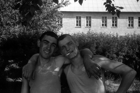 MOSCOW REGION, RUSSIA - CIRCA 1992: Portrait of soldiers of the Russian army in a sleeveless shirt. Film scan. Large grain.のeditorial素材