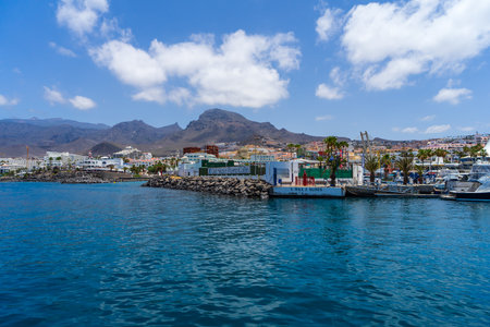 COSTA ADEJE, TENERIFE, CANARY ISLANDS, SPAIN - JULY 26, 2018: Hotels and houses on the popular coast...