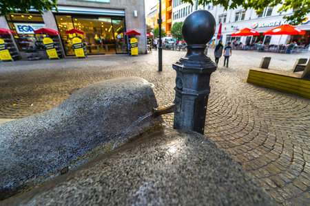 BERLIN - SEPTEMBER 09, 2018: Streets of Altstadt Spandau. A small fountain in the marketplace.のeditorial素材