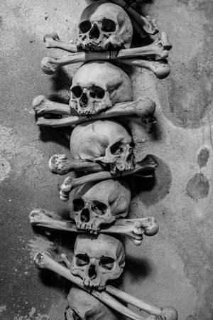 KUTNA HORA, CZECH REPUBLIC - OCTOBER 26, 2018: Detail of interior of Sedlec Ossuary, a small Roman Catholic chapel, located beneath the Cemetery Church of All Saints. Black and white.のeditorial素材