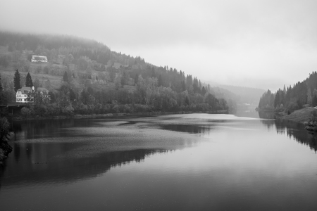 View of Elbe river and surrounding mountains - Giant Mountains (Krkonose). Small town of Spindleruv Mlyn and Labska village. Czech Republic. Black and white.の写真素材