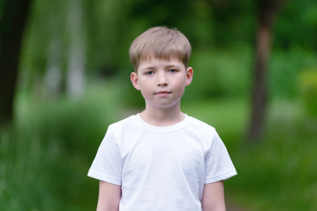 Portrait of a boy on a background of nature.の写真素材