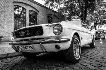 BERLIN - MAY 11, 2019: Pony car Ford Mustang (first generation). Black and white. 32th Berlin-Brandenburg Oldtimer Day.のeditorial素材