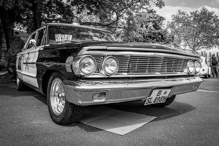 BERLIN - MAY 11, 2019: Police car Ford Galaxie 500 Interceptor, 1964. Black and white. 32th Berlin-Brandenburg Oldtimer Day.のeditorial素材
