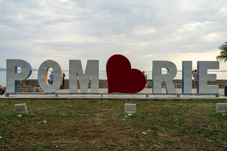 POMORIE, BULGARIA - JUNE 21, 2019: The slogan of "I love Pomorie" consisting of large letters on the embankment of the city.のeditorial素材