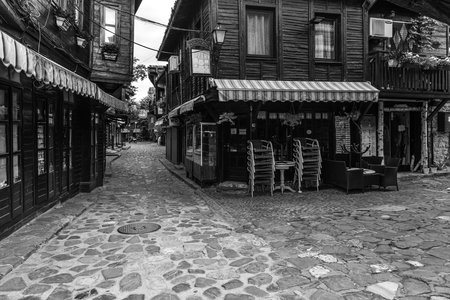 NESSEBAR, BULGARIA - JUNE 22, 2019: Beautiful and narrow street with restaurants, cafes and shops of...