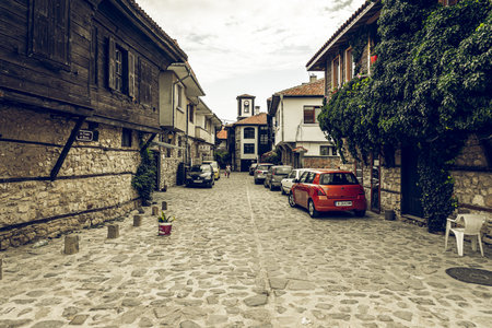 NESSEBAR, BULGARIA - JUNE 22, 2019: Beautiful and narrow street of the ancient seaside town. Deserted streets in the early morning. Toning. Vintage stylization.のeditorial素材