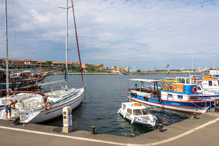 NESSEBAR, BULGARIA - JUNE 22, 2019: Pleasure and fishing boats on the pier of the old town. Nesebar is an ancient city and one of the major seaside resorts on the Bulgarian Black Sea Coast.のeditorial素材