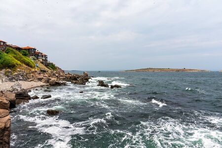 The rocky coast of the Black Sea near the ancient city of Sozopol. Bulgaria. In the In the background are the islands of St. Peter and St. Ivan.の写真素材